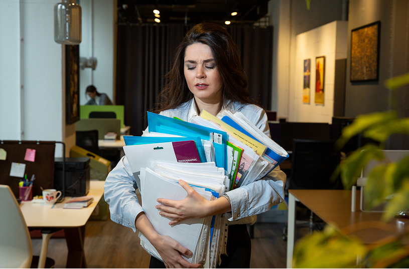 Business owner reviewing invoices and financial records